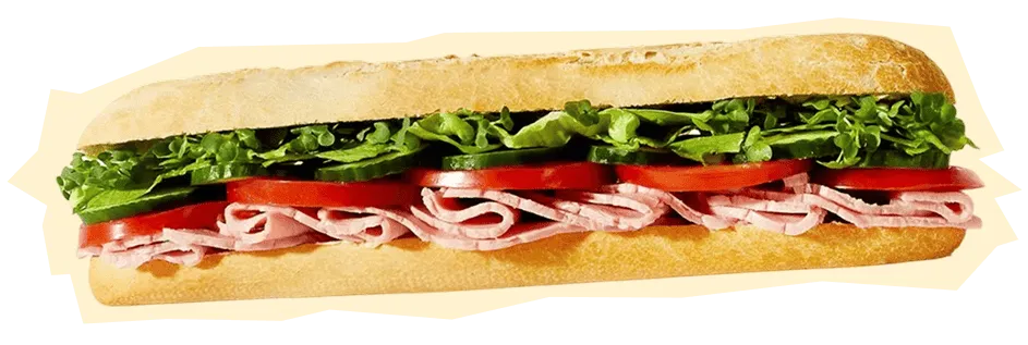 Wenzel’s ham salad baguette with lettuce, tomatoes and ham in a white demi-baguette